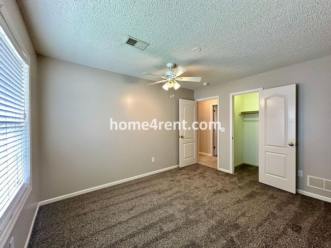 Building Photo - Beautiful Four-Bedroom Home with Three Car Garage, Wood Floors, Finished Basement and a Fenced Ya...