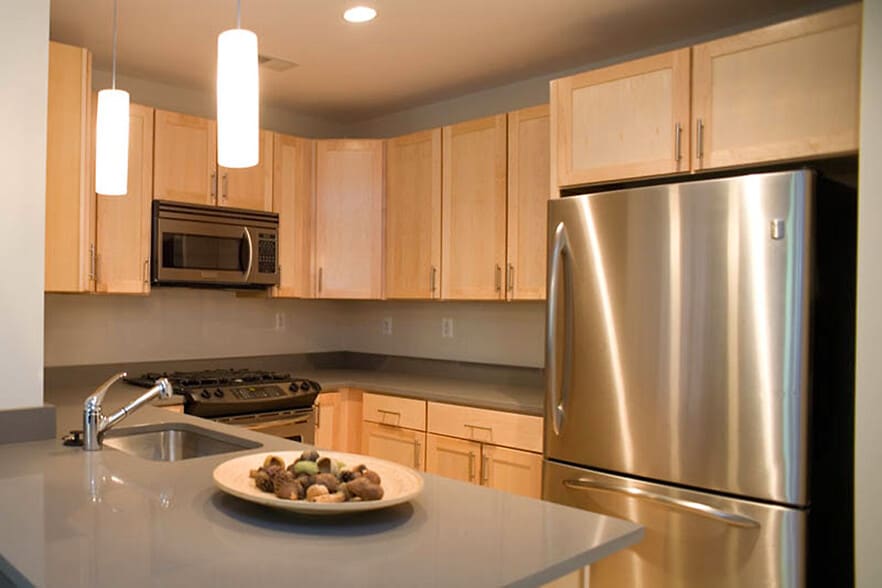 Sleek, modern kitchen featuring stainless steel appliances - 1123 6th St NW