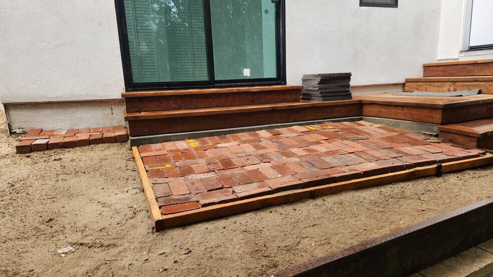 New clay patios outside both sliding doors in the bedroom and the living room - 4435 Radium Dr