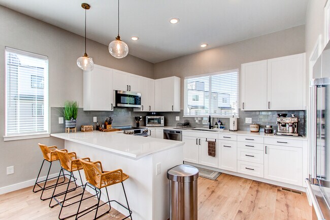 Kitchen with quartz countertops - 8500 W 62nd Ave