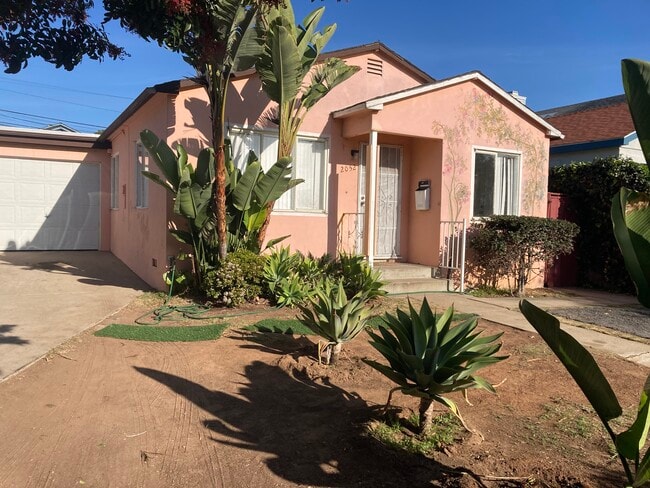 Two bedroom cute house with one car garage and one parking space available now. - 2052 Reed Ave