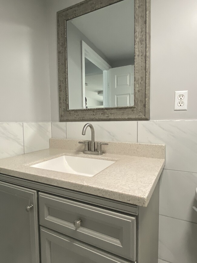 2nd Modern spacious full bath, large shower, porcelain tile floor, granite countertop - 1618 Fitzwater St