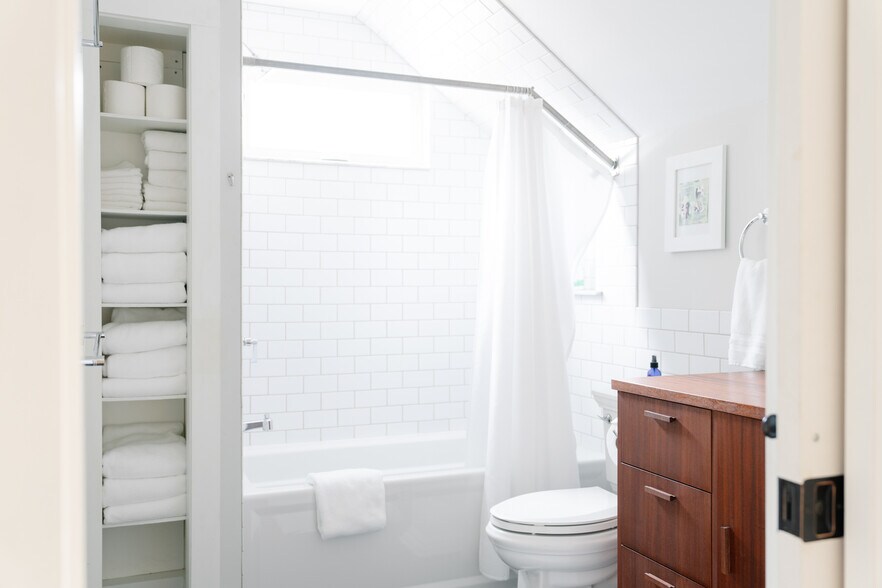 Upstairs bath with linen storage and large tub - 80 Maple St