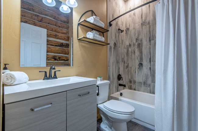Building Photo - Charming Log Cabin and Carriage House – Do...