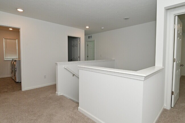 Building Photo - "Spacious 5-Bedroom Retreat with Luxurious Quartz Countertops & Fireplace on Deerberg Drive!"