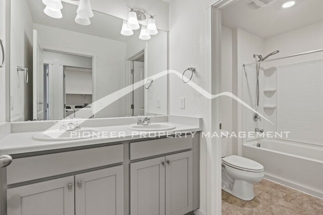 Building Photo - Modern 4-Bed, 2.5-Bath Home with 2 car garage, AC and Private Enclosed Yard