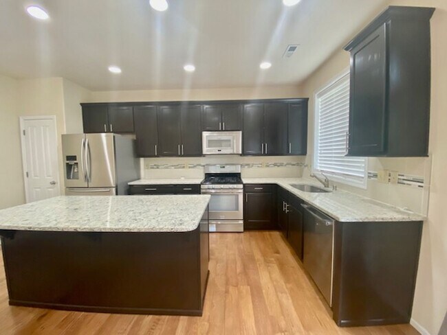 Building Photo - Beautifully Renovated 4 bedroom Home with attached 4 car garage!