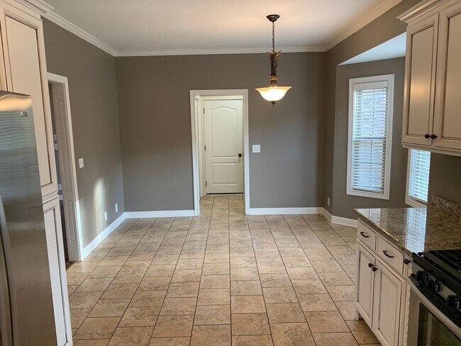Building Photo - Luxury Living! Beautiful Brick Home in Sango with 3 car garage.