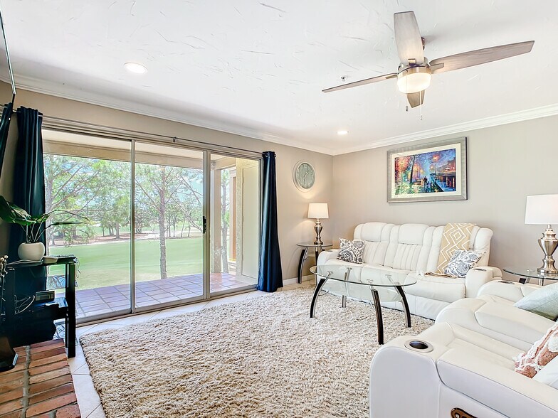 Living room, leads out to balcony - 2400 Feather Sound Dr Apt 421