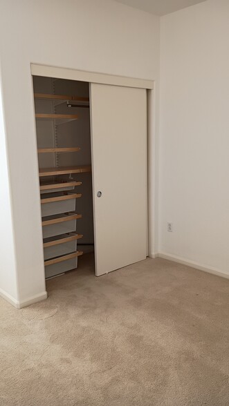 Second floor bedroom closet with drawers and shelves - 1722 Snell Pl