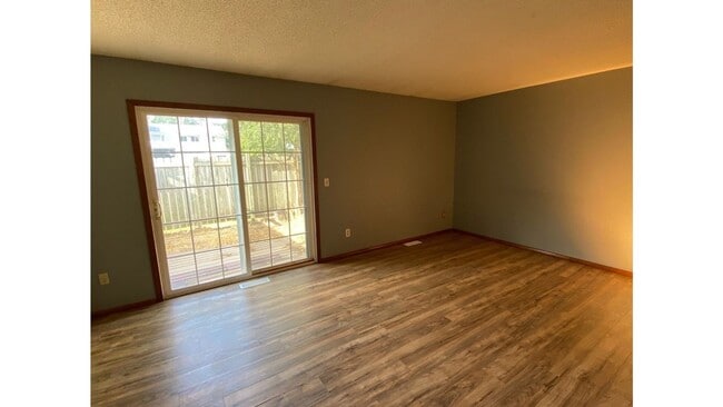 Building Photo - Spacious 3 - Bedroom Townhome with Modern Updates & Private Green Space.