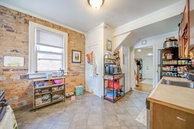 Building Photo - Charming 5-Bedroom Home with Exposed Brick and Modern Upgrades