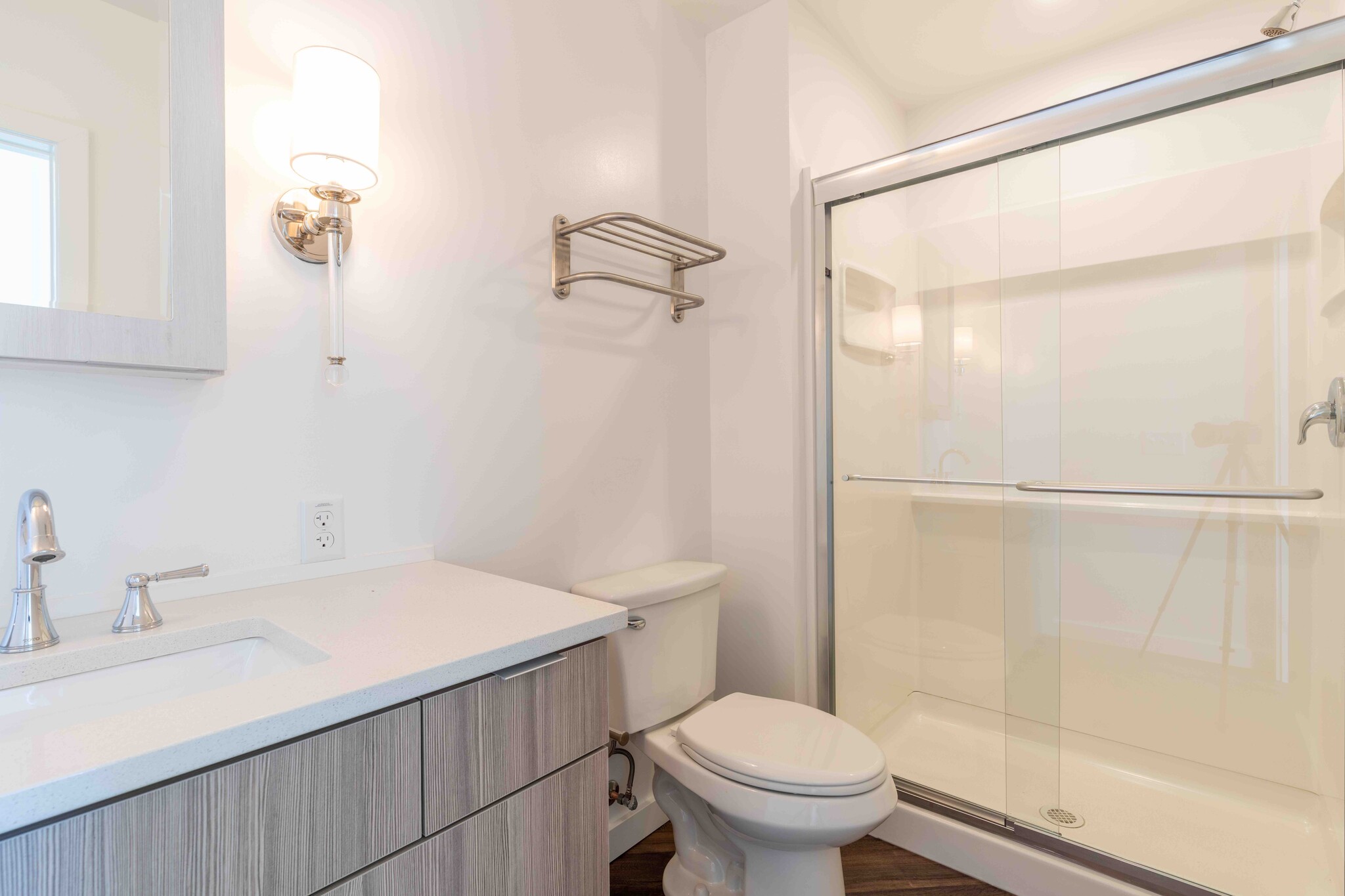 The bathroom includes a vanity and shower. - 818 12th St