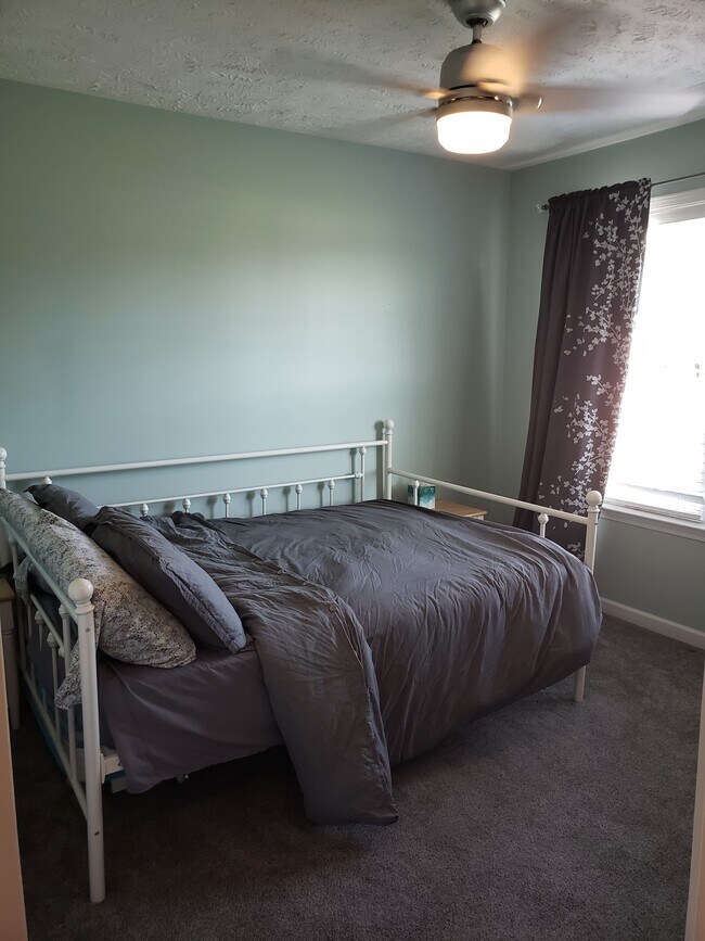 Third bedroom is bright and cheery with lots of natural light. - 820 Laramie Ct