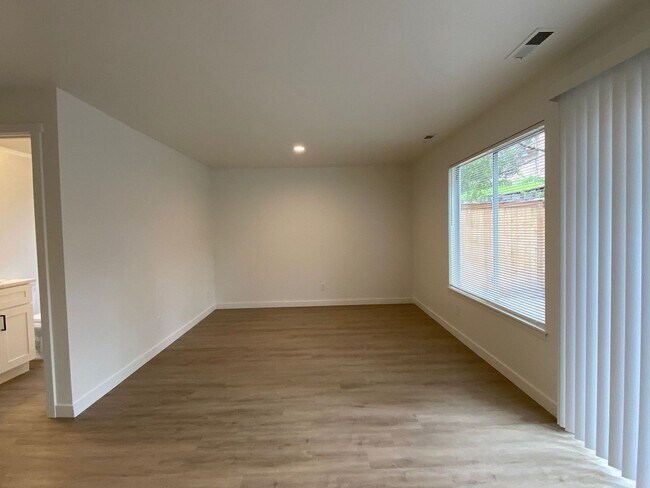 Building Photo - Stylishly Renovated Home with Private Back...