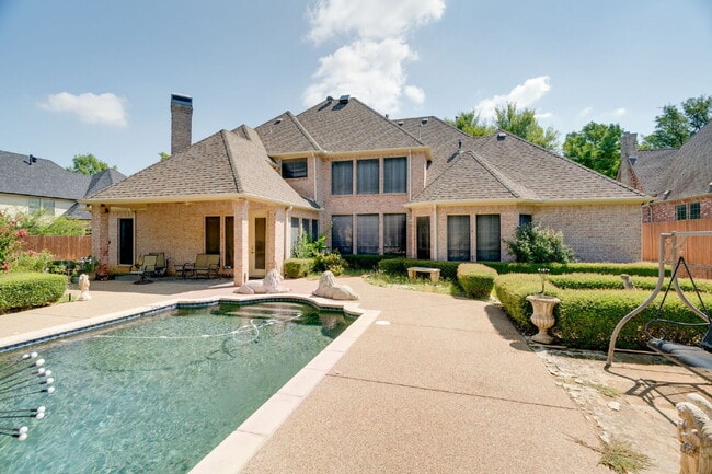 Building Photo - "Stately Gated 5-Bedroom Estate With Pool, Custom Details & Abundant Living Space!"