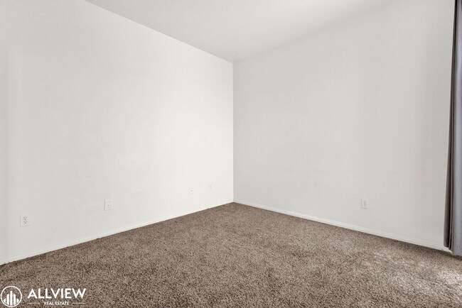 Building Photo - Spacious Coastal Condo with Rooftop Ocean ...