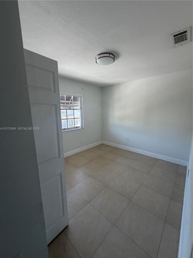 Building Photo - 7040 NW 173rd Dr