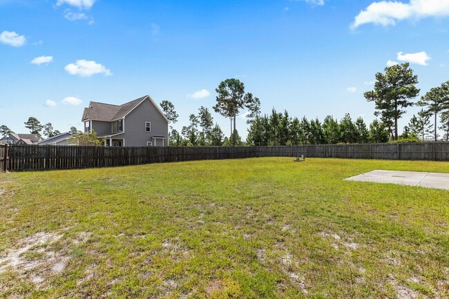 Building Photo - Spacious Home with Natural Light