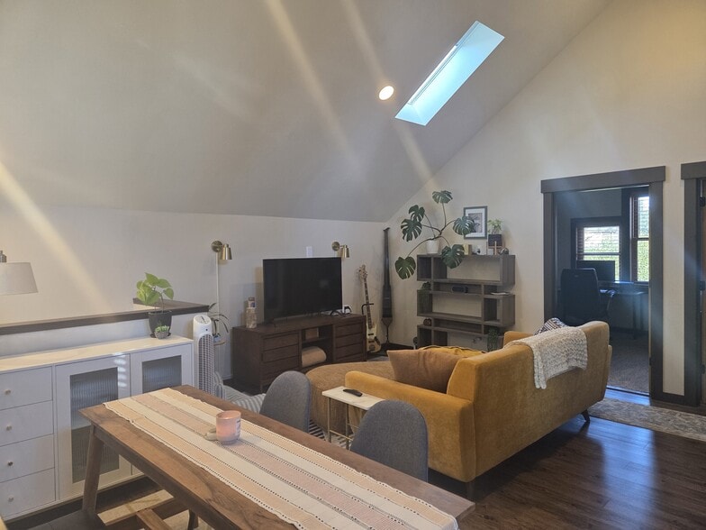 View from kitchen to living room as set up by previous tenant. - 6864 Ne Oregon St