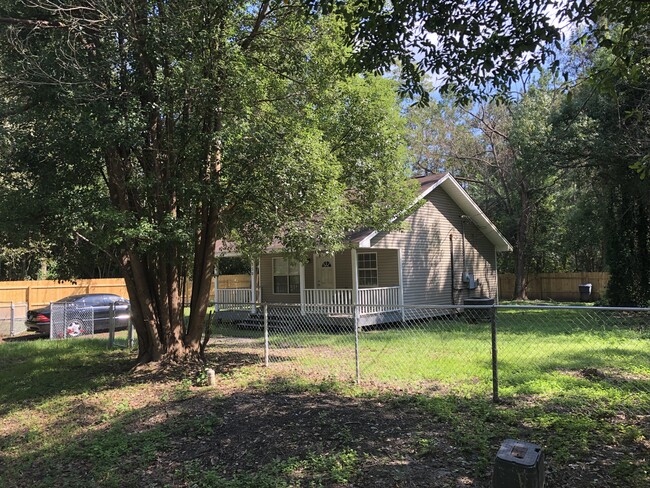 External view with Driveway & fenced yard - 950 E Avenue H