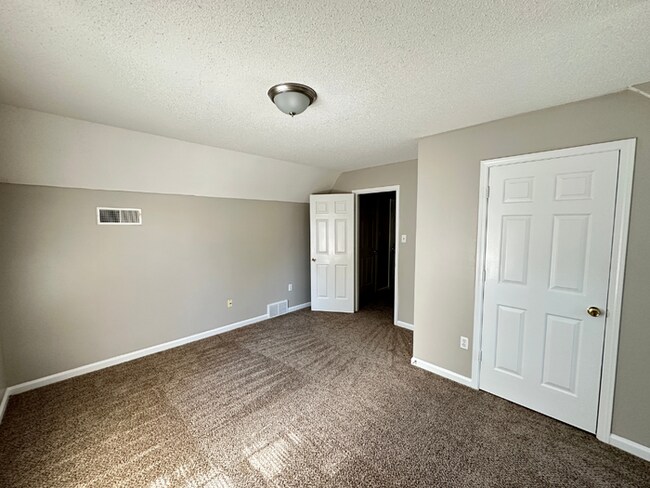 Building Photo - Charming 3BR/2BA Near Southwind | Hardwood Floors, Brick Fireplace, Bay Window & 2-Car Garage