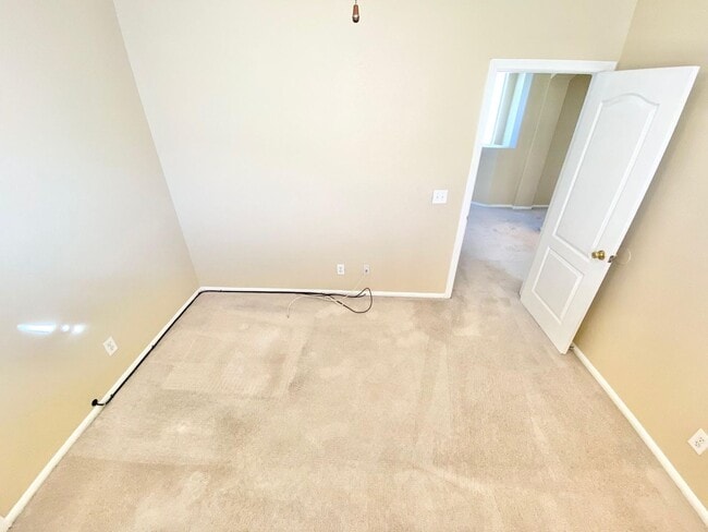 Building Photo - THIS SPACIOUS RESIDENCE FEATURES 4 BEDROOM...