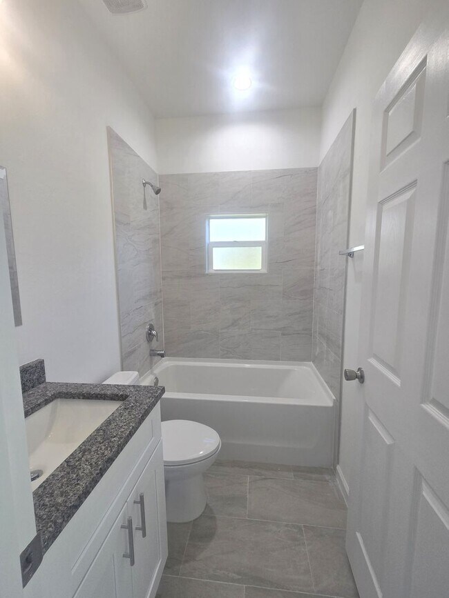 Building Photo - Brand New 4/2/2- South Lehigh Acres