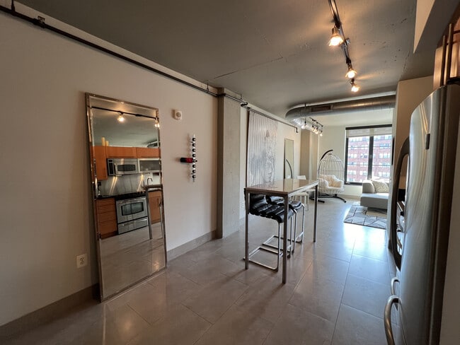 Kitchen with custom-made marble bar table, leather bar chairs and from Restoration Hardware, - 1133 14th St NW