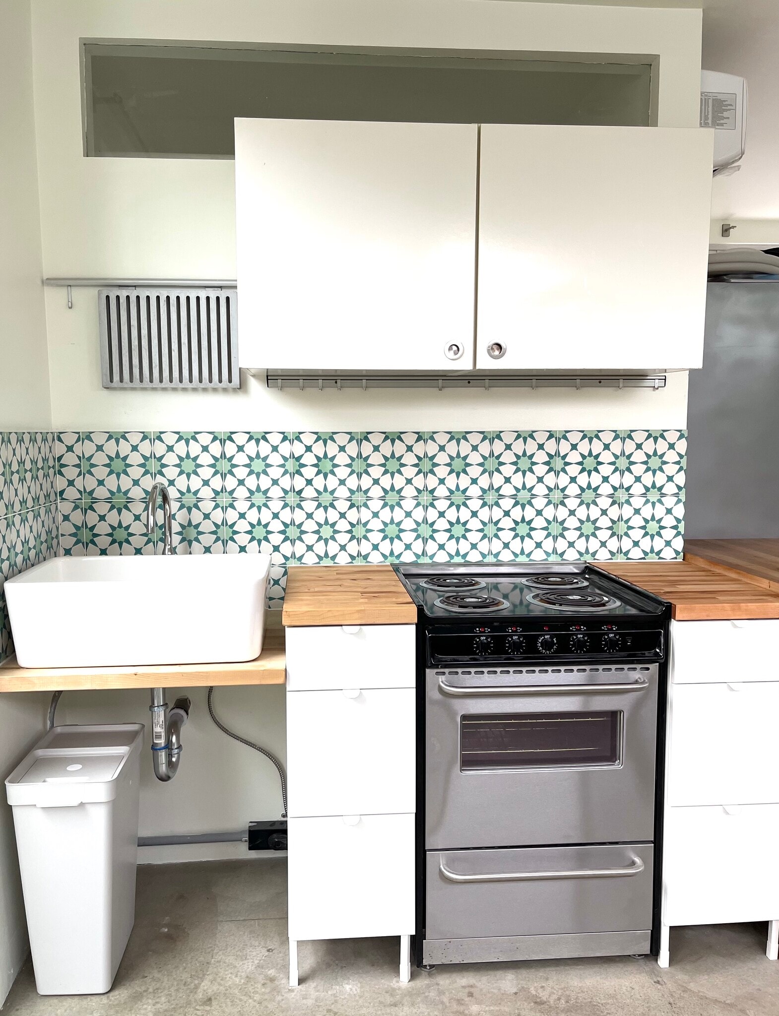 kitchen with custom tile backsplash, butcher block counters, stove/range - 939 Indiana Ave
