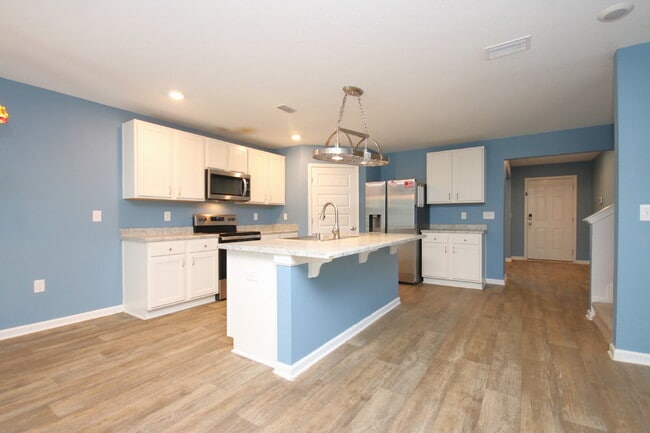 Building Photo - Spacious 5-Bedroom Home Near NAS with Move...