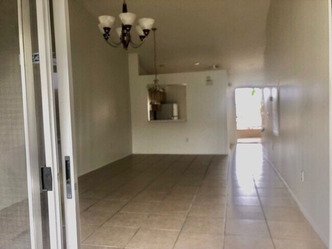 Building Photo - Nice 2X2 located on 2nd floor- Tile & lami...