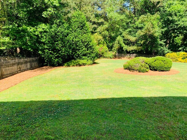 Building Photo - Great location! Lawncare/water is included...