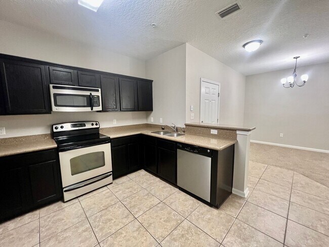 Building Photo - Stylish 3 Bedroom, 2 bath Condo with Woode...