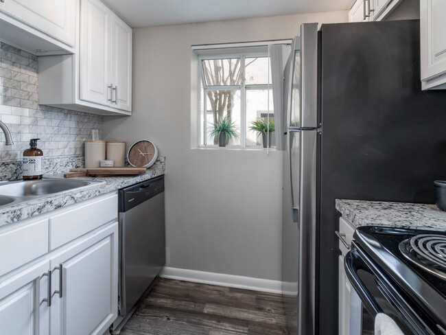 New Upgraded Kitchens with Stainless Steel Appliances - Liv at Winter Park Apartment Homes