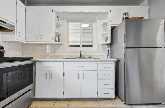 Building Photo - Updated Brick Ranch with Gorgeous Finishes & Ideal Location!