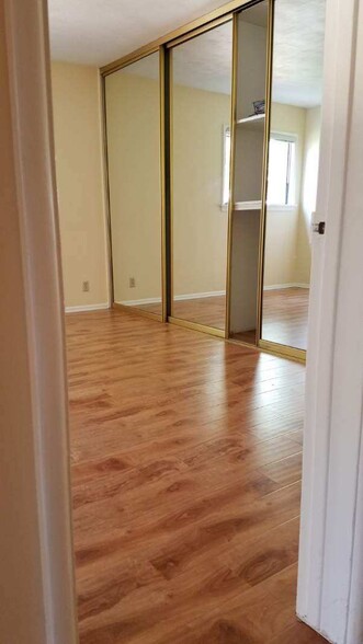 MASTER BEDROOM WITH MIRRORED WALL TO WALL CLOSETS - 12051 Alberta Dr