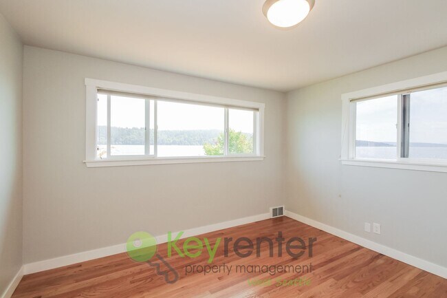 Building Photo - Waterfront Elegance with Private Dock and Designer Finishes