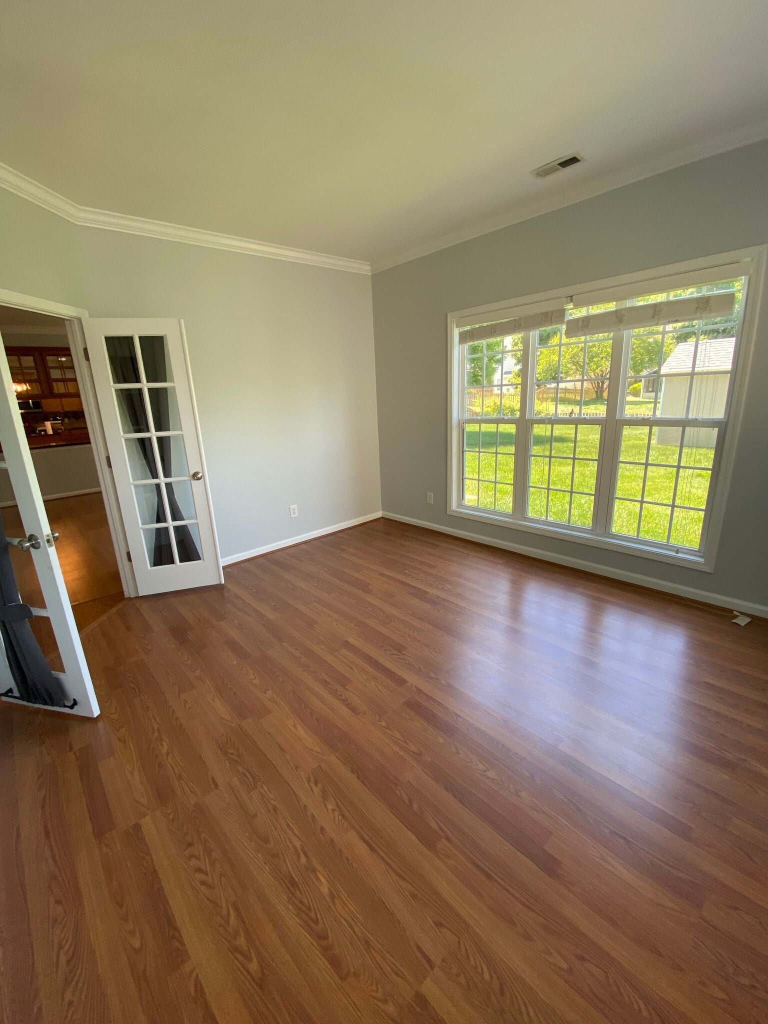 downstairs bedroom/office/playroom with view of large, fenced yard - 10102 Glenburn Ln