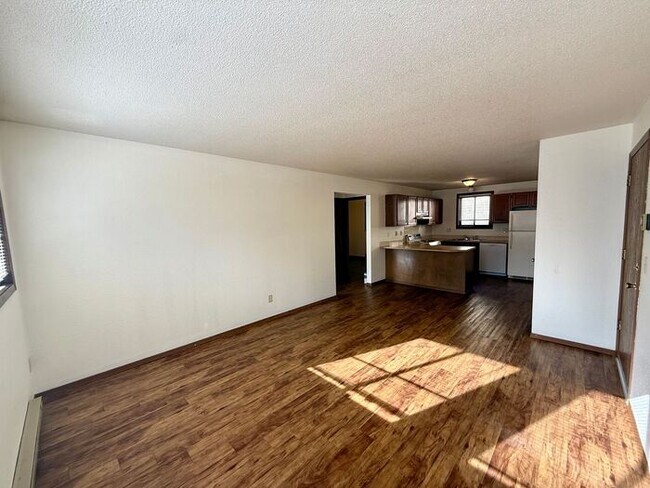 Building Photo - FIRST TWO WEEKS FREE!!! Cozy 2 Bed/1 Bath Apartment in North Loveland. New Wood Floors!
