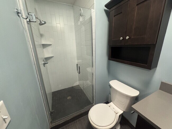 Building Photo - "Charming Studio Retreat with Hardwood Elegance in Downtown Minneapolis!"