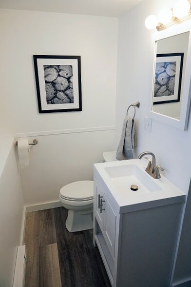Brand-new bathroom with dedicated heater, bright lighting, and provided linens. - 9 May St