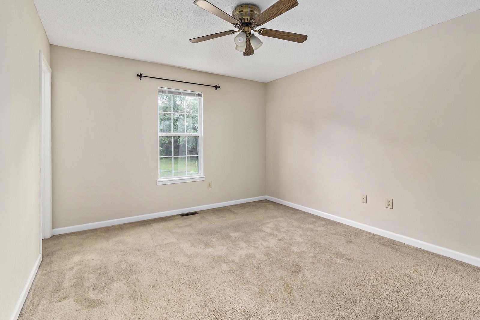 Master bedroom with ceiling fan and on suite bathroom - 1805 Colt Dr