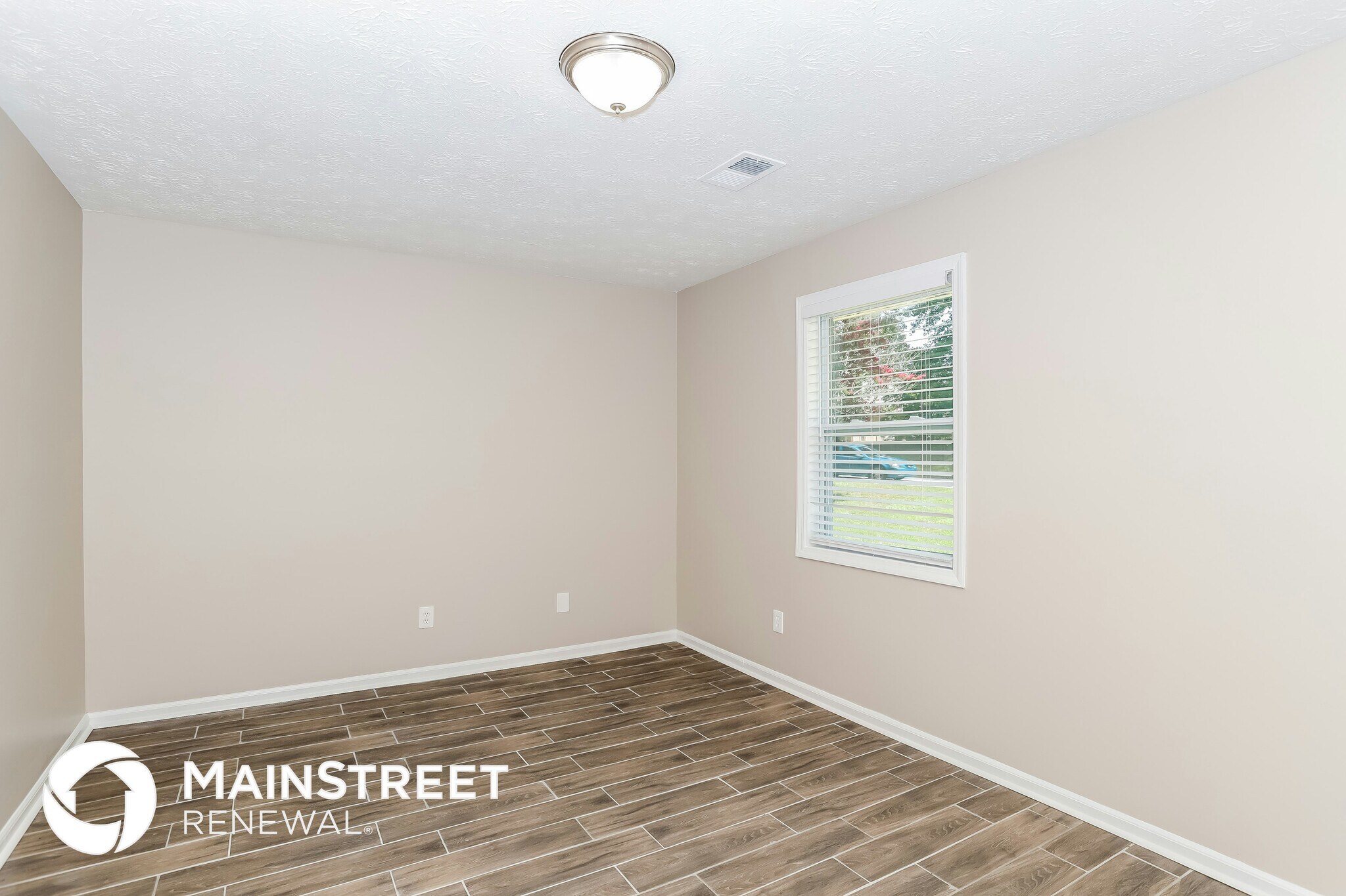 Building Photo - 9073 Woodgreen Way