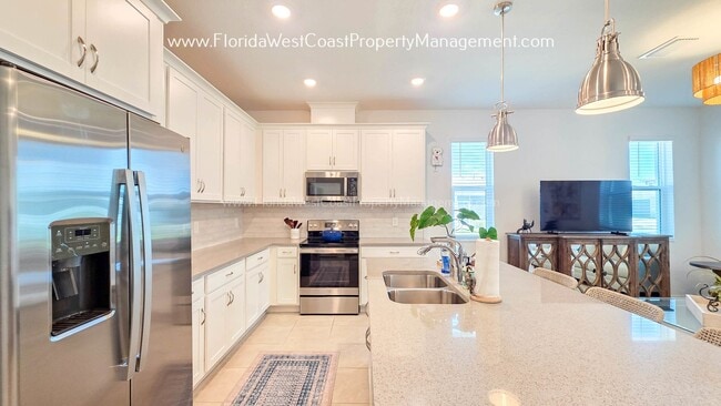 Building Photo - EXCEPTIONAL AND SPACIOUS FURNISHED TOWNHOME WITHIN WATERSIDE- NAUTIQUE!
