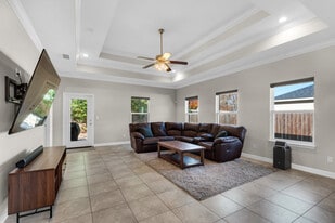 Living room has a huge TV, surround sound, blackout shades, and huge couch - 28 Snook Rd