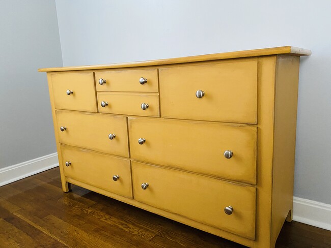 Dresser in the bedroom with three twin beds. - 1101 Brookwood Cir