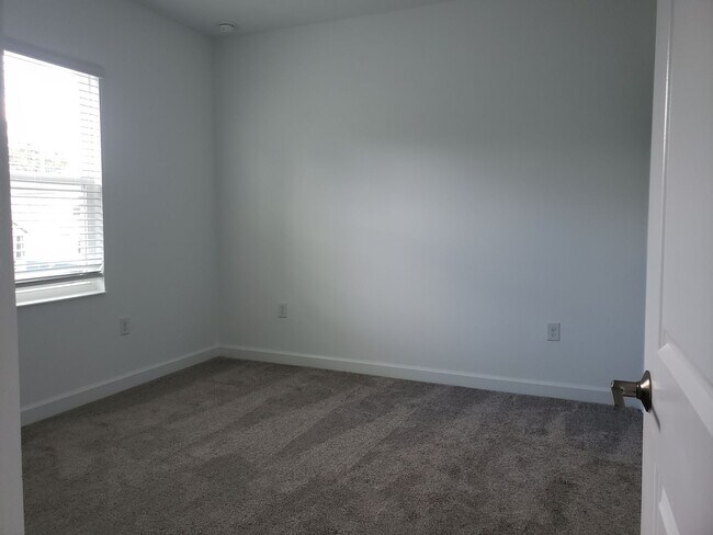 Building Photo - Bridgewalk Corner Lot Home with Wooded View and Solar Panels