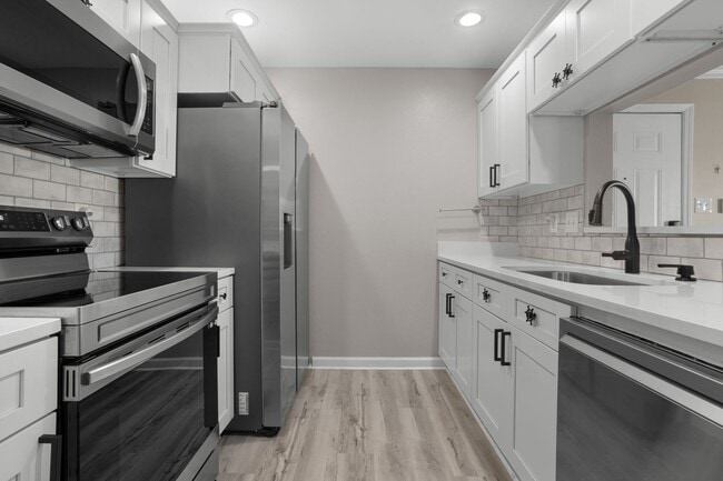 Building Photo - Welcome to Harbor Landing Condominiums — where coastal living meets convenience!