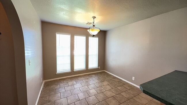 Building Photo - Welcome to this charming 3-bedroom, 2-bath...